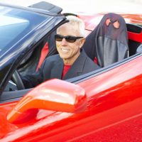 senior driving with sunglasses